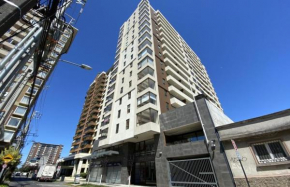 Departamento central con estacionamiento